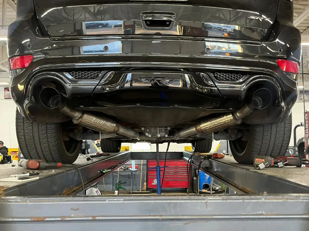 Black SRT Vehicle on Lift with Visible Exhaust System