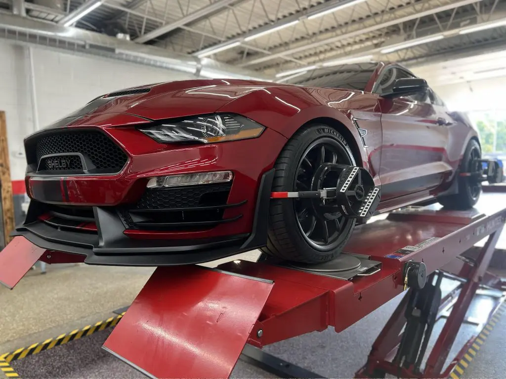 Red Shelby Mustang on Lift with Alignment Equipment